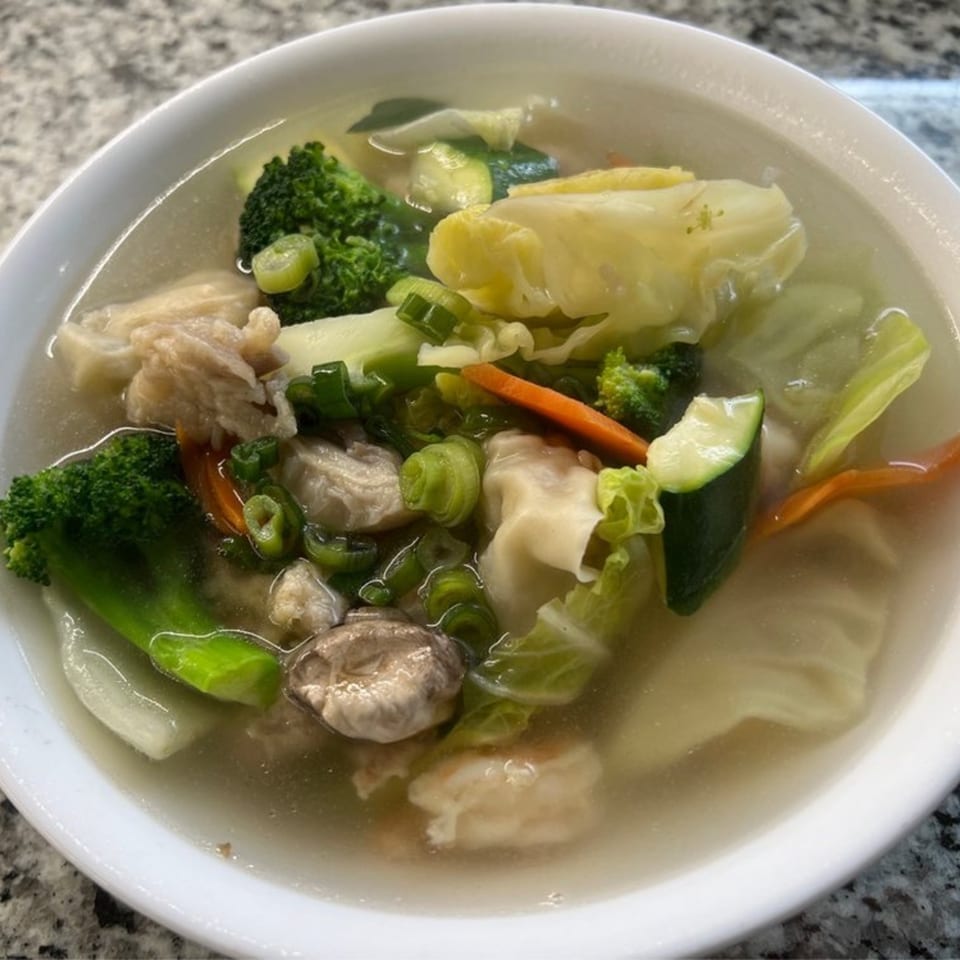 Wong's Wok Chinese Kitchen's wonton soup with broccoli, cabbage, carrots, zucchini, and scallions.